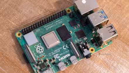 Close-up of a Raspberry Pi 4 Model B board showing the GPIO header and USB ports.