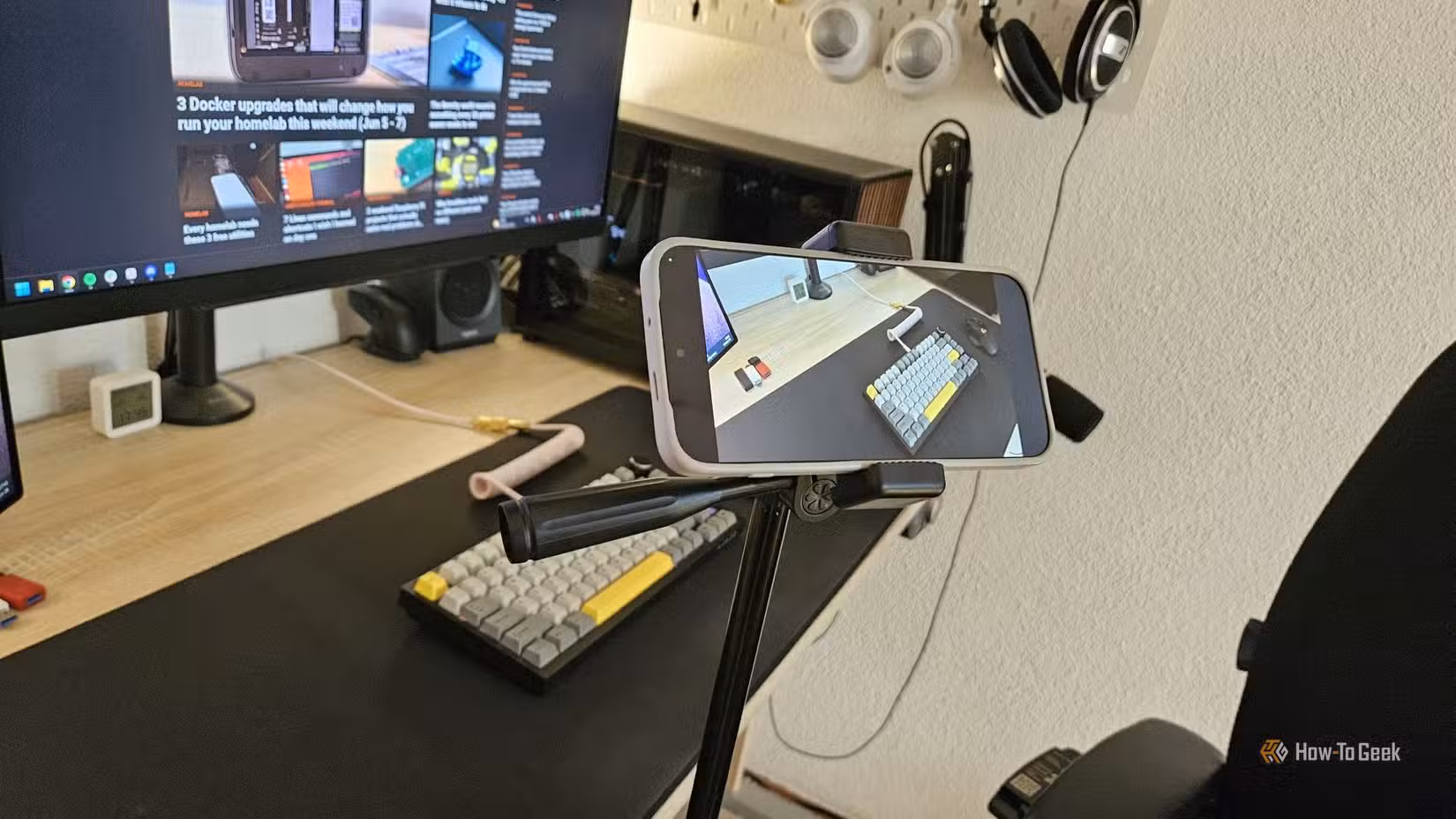 A smartphone mounted on a tripod recording a time-lapse video.