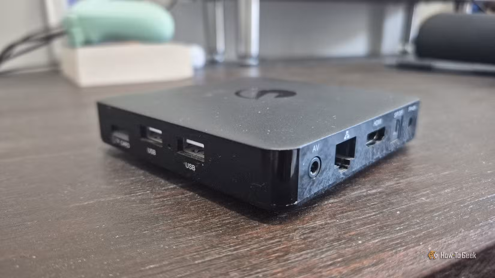 An Ematic dv8235 Android TV box on a desk