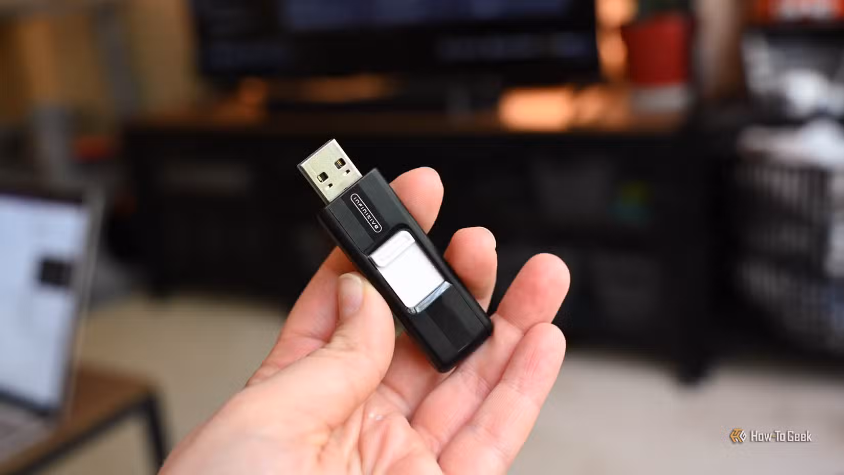 Person holding a USB thumb drive.