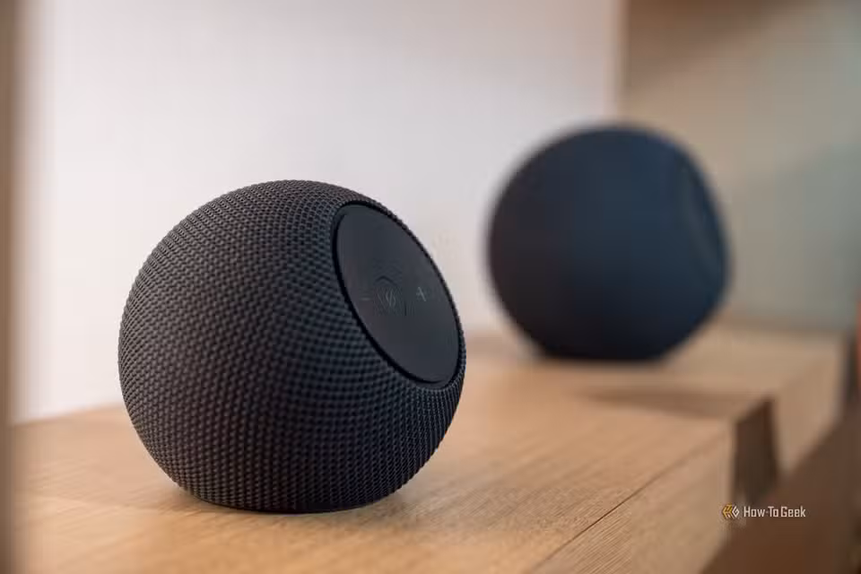 Amazon Echo Dot Max and Studio on a shelf.