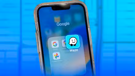 A phone with the Waze icon overlapping the Google Maps icon.