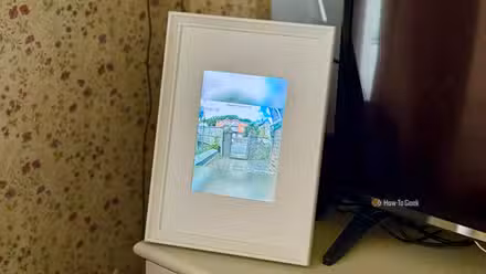 A photo frame containing the display of an iPad 2 showing the live stream from a video doorbell.