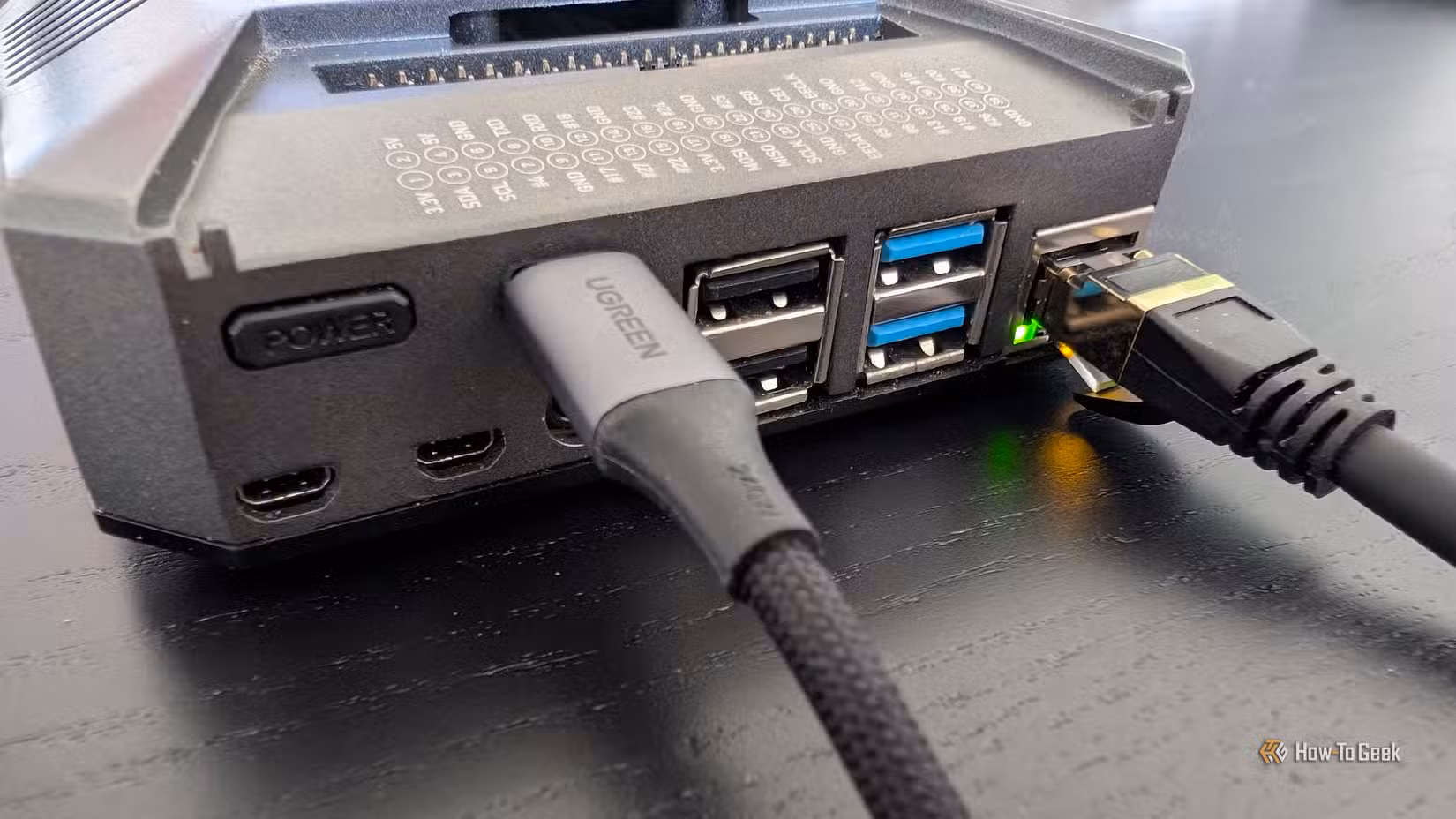 A Raspberry Pi 4 with an ethernet cable attached in the back.