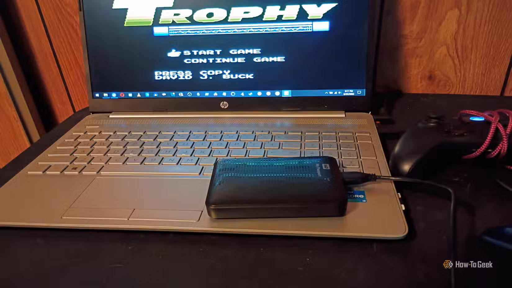 A western digital hard drive sits on a laptop keyboard.