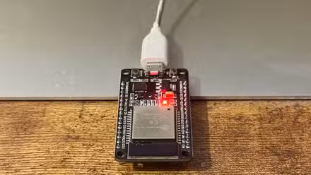 An ESP32 with the red LED lit up acting as an internet status light.