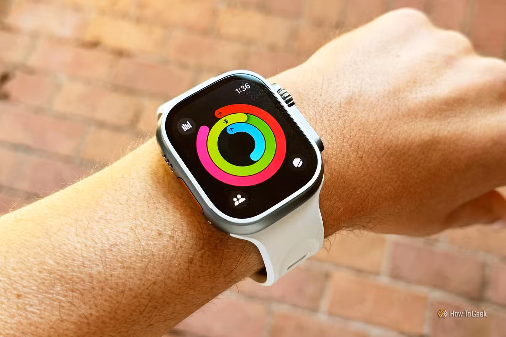 Apple Watch Ultra 2 showing activity rings almost completed.