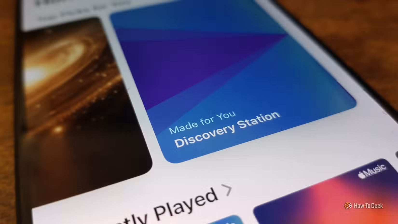 Close up of an iPhone showing the Discovery Station in the Apple Music app.
