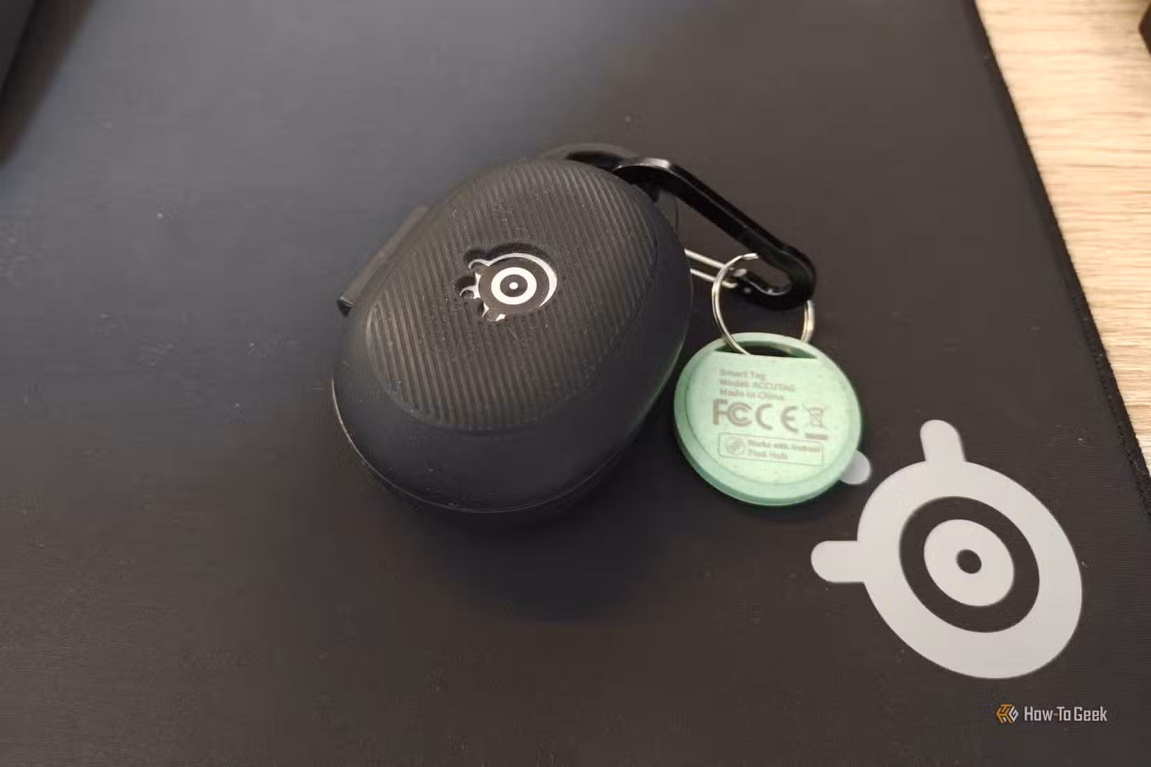 An Android tracking tag attached to an earbuds case.
