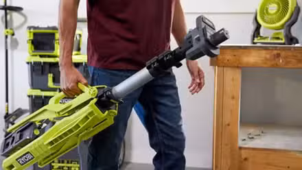 Guy carrying Ryobi tripower light