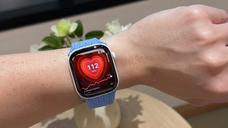 A ceramic Apple Watch Series 12 on a person's wrist