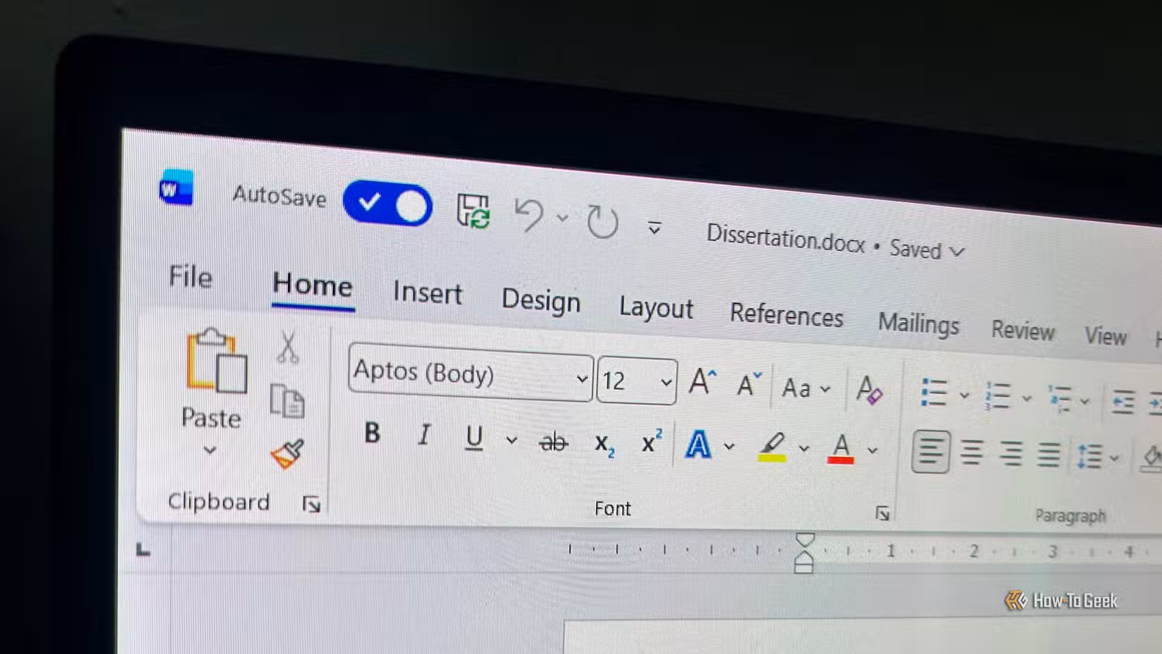 Laptop screen showing the AutoSave toggle in Microsoft Word.