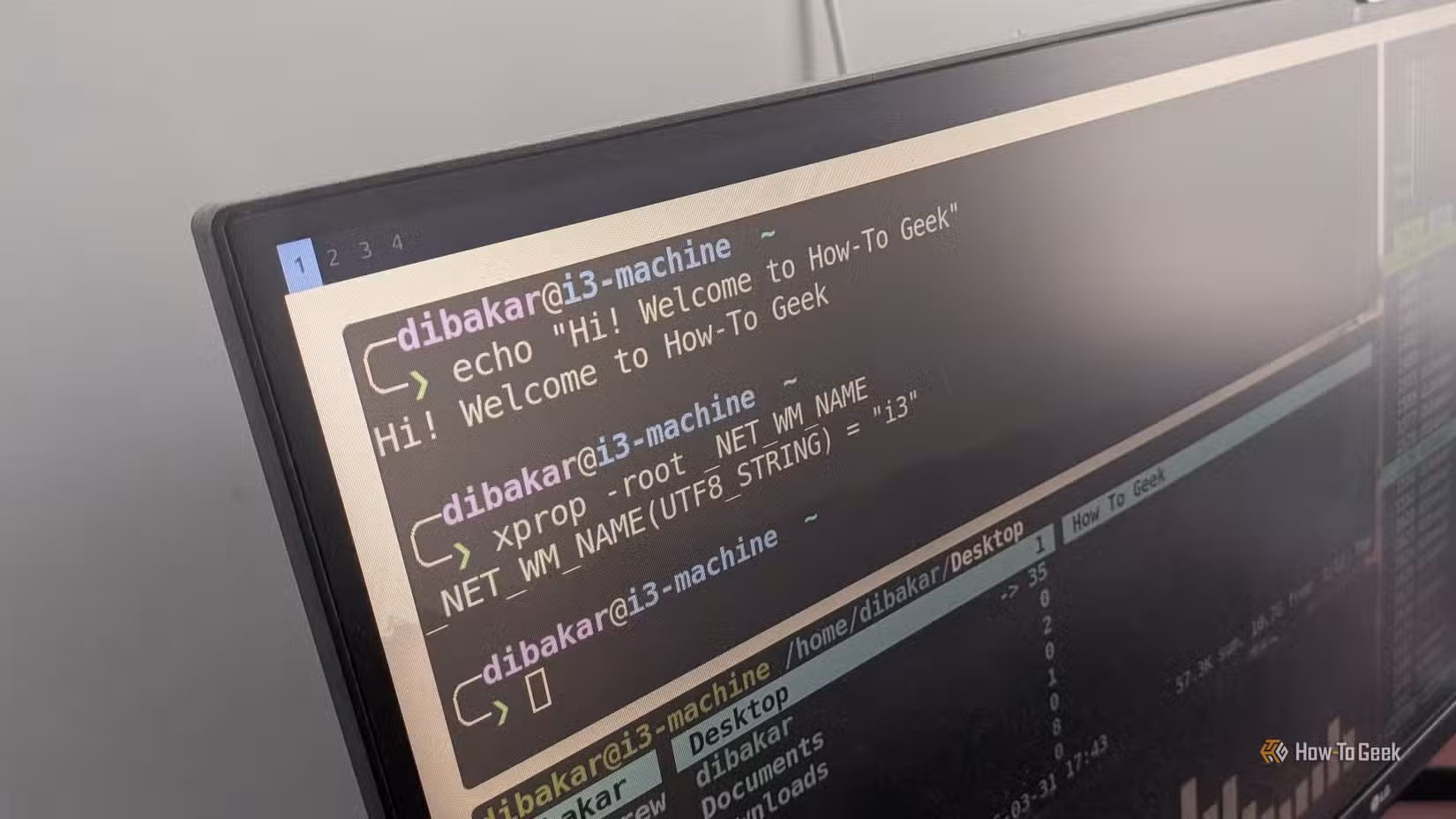 Monitor showing i3 tiled terminal layout with xprop confirming window manager is i3.