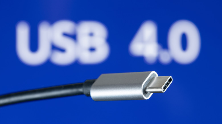 USB-C cable in front of a blue USB 4.0 background.