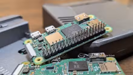 A Raspberry Pi Zero 2 W on top of two Pi 4s and a Pi Zero. 