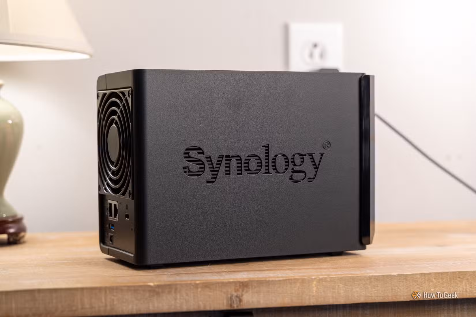 Rear side view of the Synology DS225 Plus 2-bay NAS with fan and ports visible.