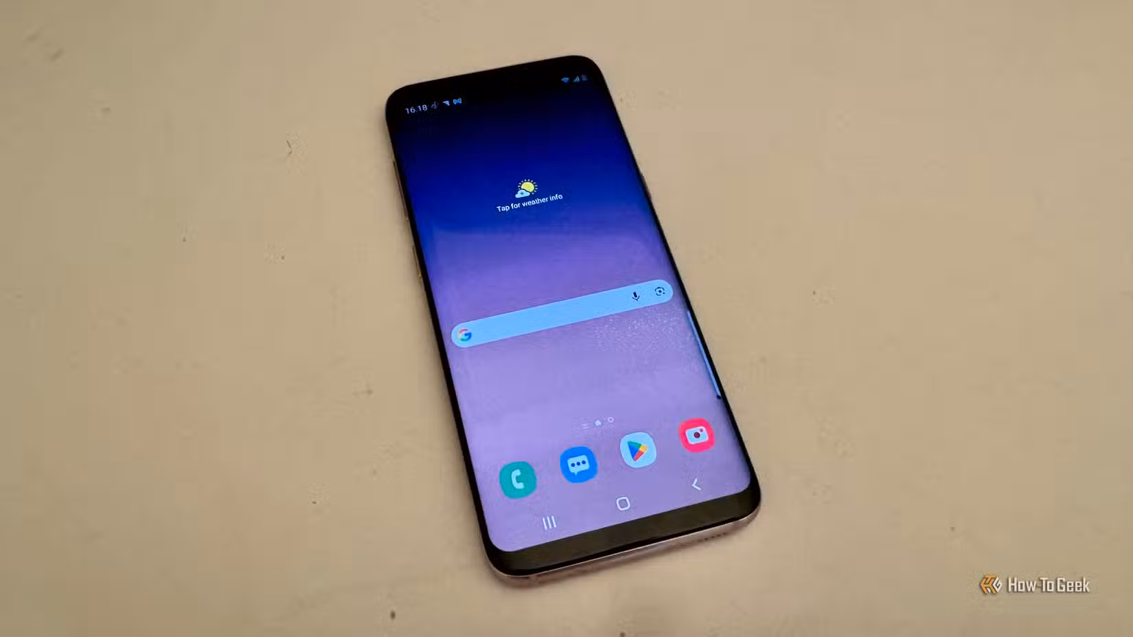 Samsung Galaxy S8 home screen showing the Google search bar and app shortcuts.