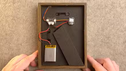 A temperature and humidity sensor hidden in an IKEA photo frame by Microamp Home on Youtube