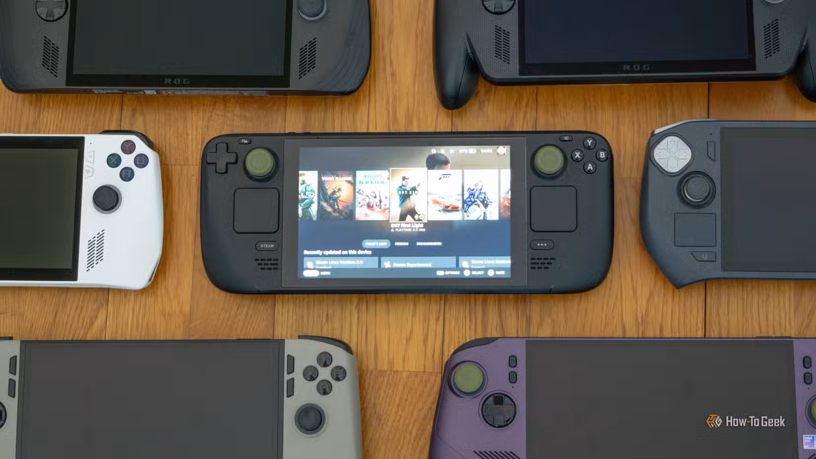 Seven Handheld PCs lying on a floor.