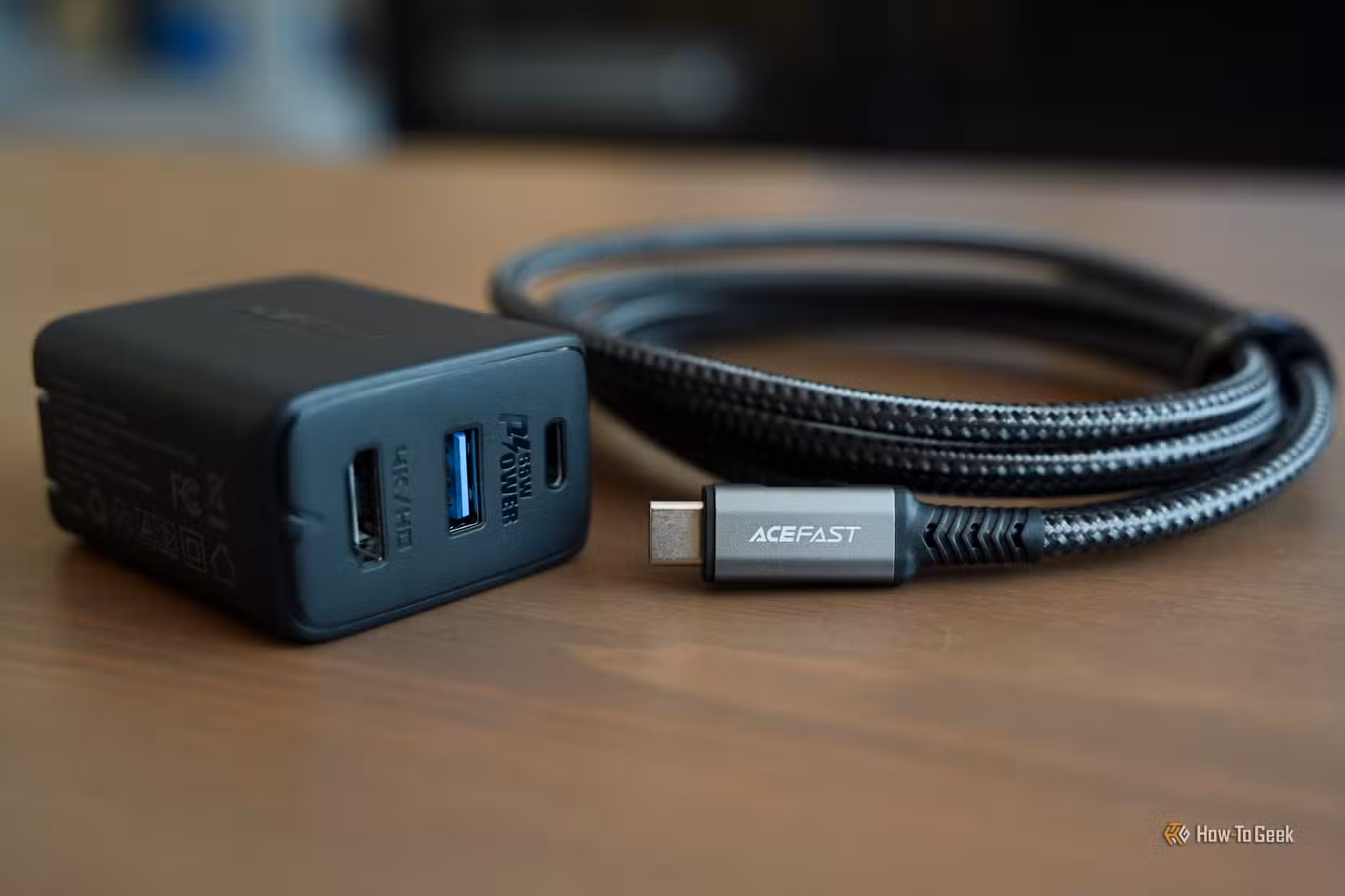 The ACEFAST GaN PD65W 3 Port Fast Charger Hub with its cable