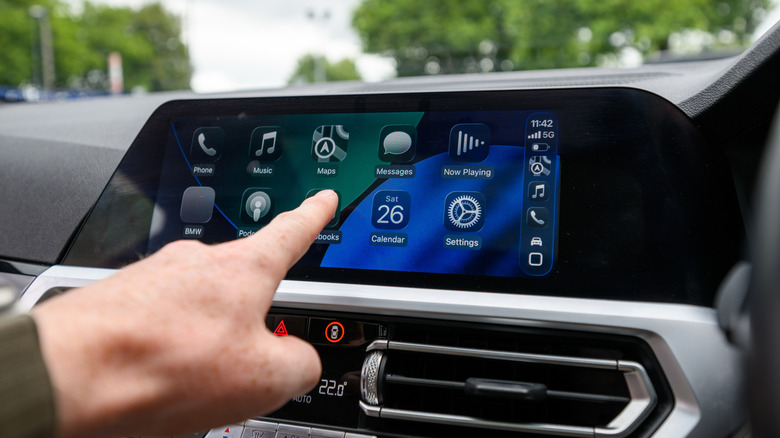 Apple's CarPlay home screen on a car's dashboard.