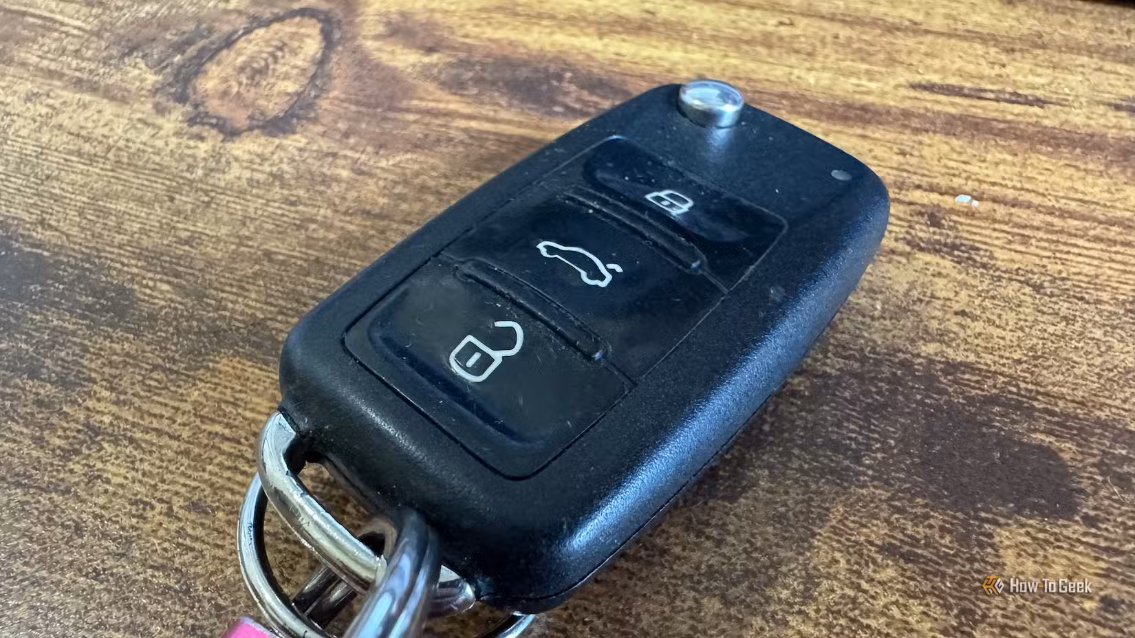 The key fob for a VW Polo on a desk.