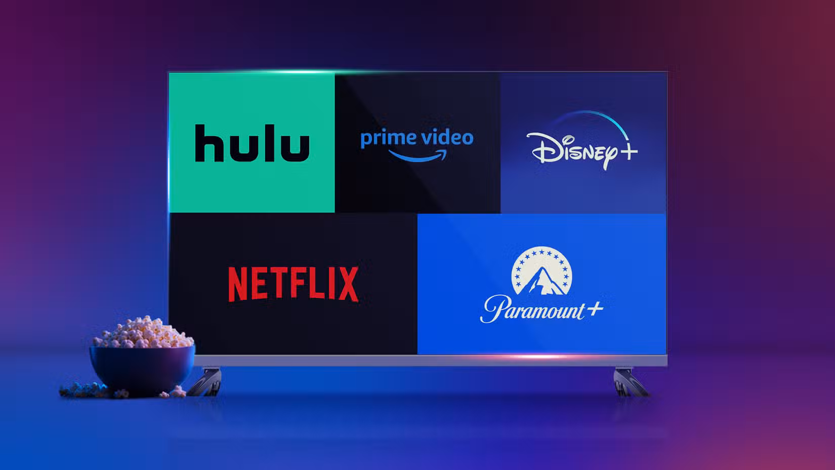 TV showing Hulu, Prime Video, Disney+, Netflix, and Paramount+ logos with a bowl of popcorn beside it.