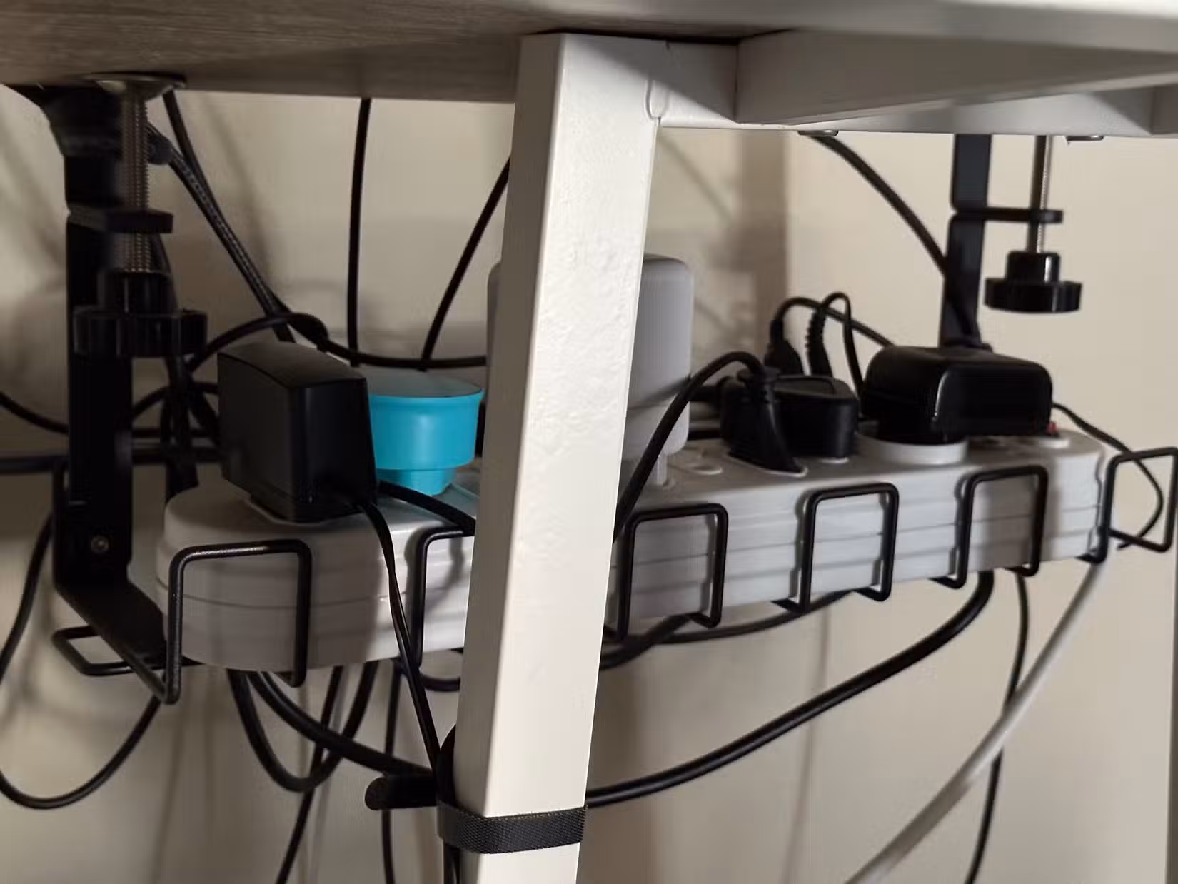 Under-desk cable basket.
